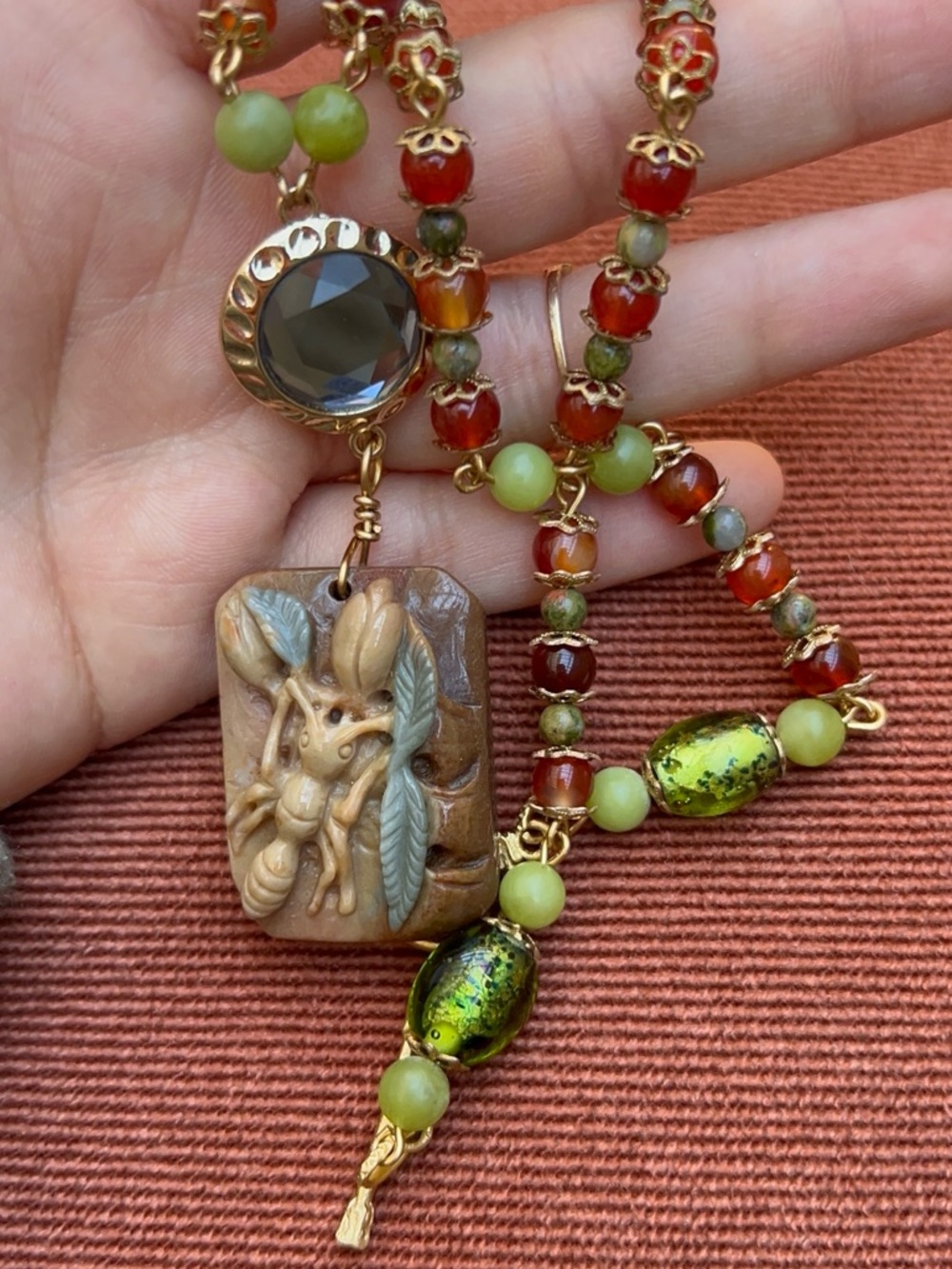 Artisan Green and Brown Beaded Necklace with Ant Carved Pendant